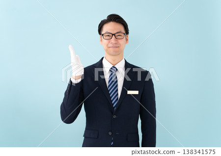 Businessman with white gloves holding hands 138341575