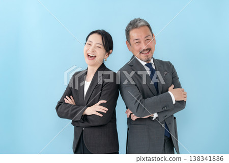 Business men and women arms crossed 138341886