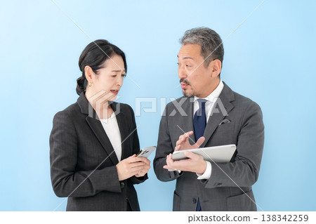 Business conversation between men and women - astonishing 138342259