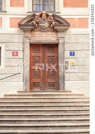 Ancient ornate carved wooden door and Baroque portal at Prague Castle 138342825