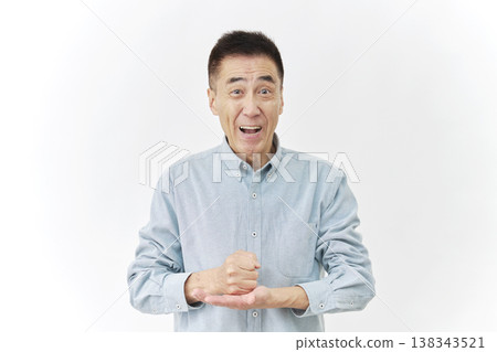 A senior man has an idea and takes action. 138343521