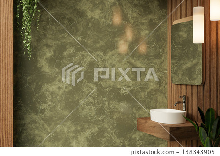Mirror and lamp over wooden sink counter and hanging plant on green marble wall in a modern bathroom 138343905