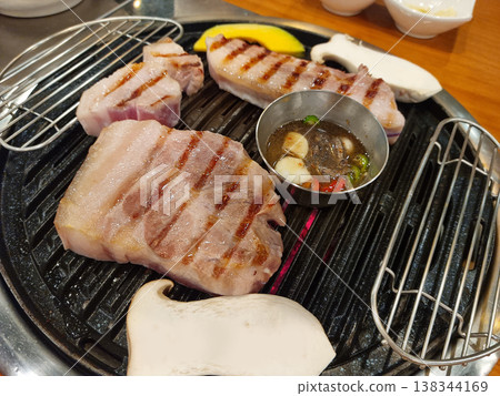 This is pork grilling on the grill. This is pork grilling on the grill. 138344169