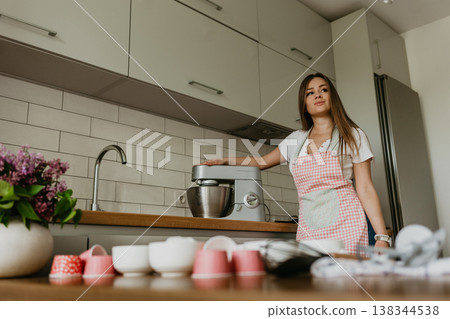 beautiful young chef decorating delicious dessert beautiful young chef decorating delicious dessert 138344538