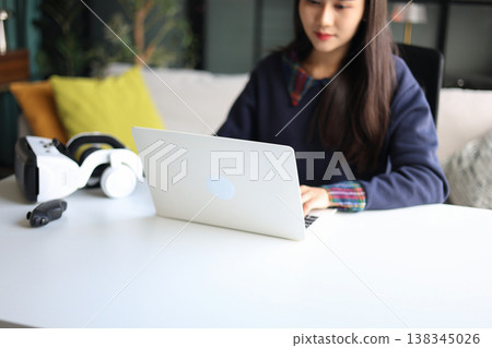 Women working with laptop and VR headsets. Women working with laptop and VR headsets. 138345026