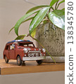 Stylish interior decor: A model of a classic red car. 138345780