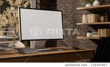 White screen computer with books and paper rack on wooden table aside window and shelf on brick wall White screen computer with books and paper rack on wooden table aside window and shelf on brick wall 138345957