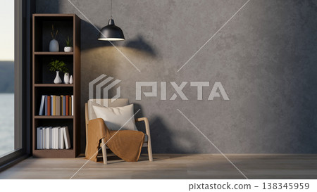 A wooden armchair under hanging lamp and bookshelf on parquet floor aside grey loft wall and window. 138345959