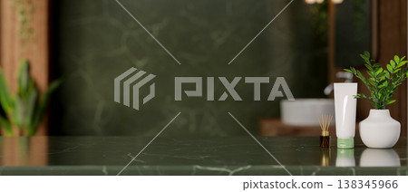 White tube and diffuser with potted plant on green marble countertop in natural stone wall bathroom. White tube and diffuser with potted plant on green marble countertop in natural stone wall bathroom. 138345966