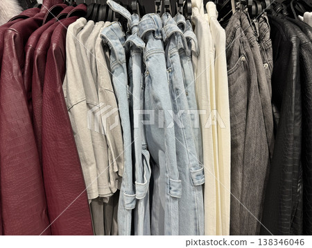 Clothing rack jeans jackets shirts fashion retail store display Clothing rack jeans jackets shirts fashion retail store display 138346046