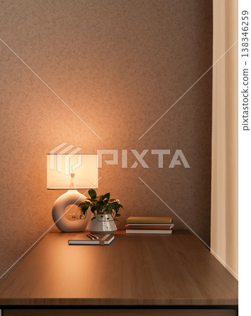 Books and potted plant on wooden counter table under warm light of a hollow lamp in dim room or cafe Books and potted plant on wooden counter table under warm light of a hollow lamp in dim room or cafe 138346259