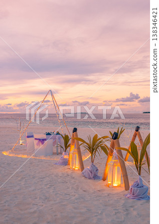 Romantic beach dinner with candles and artistic table setting, ocean view summer honeymoon wedding anniversary outdoor design background Romantic beach dinner with candles and artistic table setting, ocean view summer honeymoon wedding anniversary outdoor design background 138346421