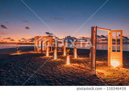 Amazing beach dinner at sunset with ocean view, romantic sky and clouds, cozy candlelight table with floral decoration, destination dining honeymoon wedding anniversary background Amazing beach dinner at sunset with ocean view, romantic sky and clouds, cozy candlelight table with floral decoration, destination dining honeymoon wedding anniversary background 138346439