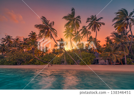 Perfect tropical sunset beach with exotic ocean shore, relaxing tranquil summer vacation wallpaper, breathtaking sunlight and nature outdoors 138346451