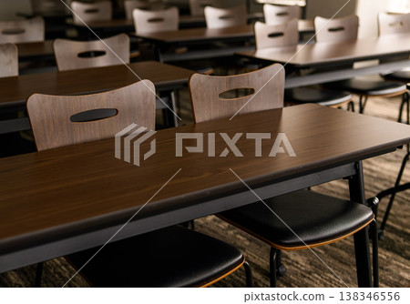 Desks and chairs in an empty classroom Desks and chairs in an empty classroom 138346556
