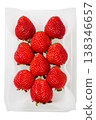Premium large strawberries, packaged, white background, overhead view. 138346657