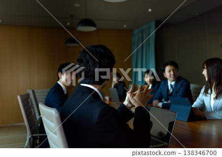 The back of a businessman speaking in a conference room The back of a businessman speaking in a conference room 138346700
