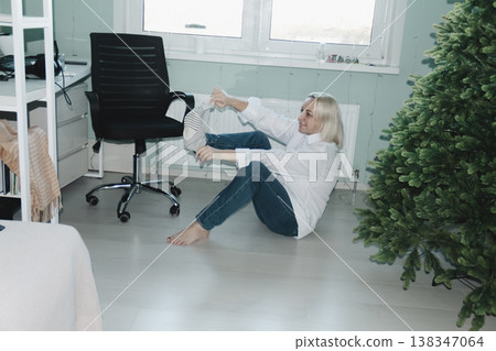 Distracted from job happy peaceful blonde businesswoman relaxing with folded hands behind head, dreaming of future challenges or planning weekend, satisfied with good job done, end of workday. 138347064
