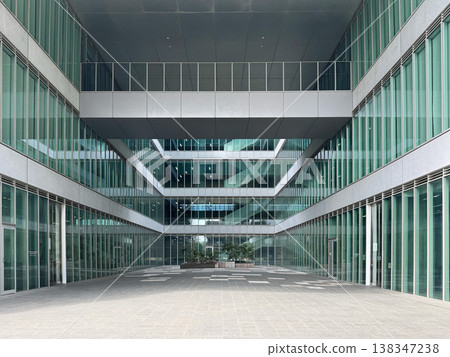 Courtyard of a glass-walled office building Courtyard of a glass-walled office building 138347238