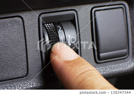 Car Headlight Leveling Switch Closeup 138347344