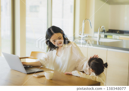 A man working from home in his living room. A man working from home in his living room. 138348077