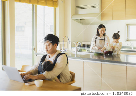 A man working from home in his living room. A man working from home in his living room. 138348085
