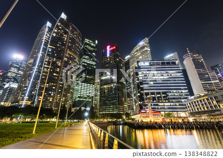 Night view of the Marina Bay Financial Centre and the Raffles Place modern office skyscrapers along Marina Bay in Singapore.  138348822