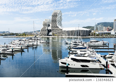 View of Argo Yacht Marina at Glory Pier of Kaohsiung Port, Taiwan, and the Kaohsiung Music Center building. 138348823