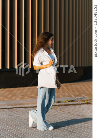 Teen Girl Walking Outdoors Teen Girl Walking Outdoors 138349152
