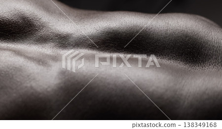 Fitness, man and muscle and closeup in studio for wellness, stomach and body on dark background. Person, torso and six pack with bodybuilder or guy and strength, topless and zoom or abdomen 138349168