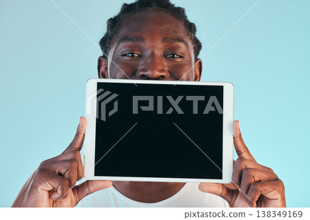 Tablet, screen and black man with mockup in studio with news, promo or announcement on blue background. Digital, offer and portrait of African male model show space for social media, sign up or deal Tablet, screen and black man with mockup in studio with news, promo or announcement on blue background. Digital, offer and portrait of African male model show space for social media, sign up or deal 138349169