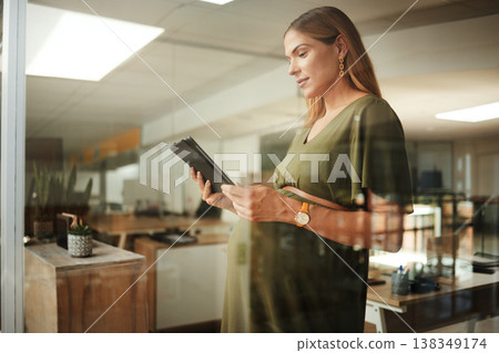 Pregnant woman, reading and tablet in office for business, networking or ideas for marketing. Person, touchscreen and thinking at work for communication, research or internet chat at company 138349174
