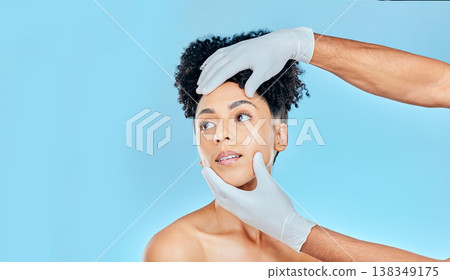 Skincare, plastic surgery and woman with hands on face in studio at cosmetic consultation. Model with spa, facial and filler for beauty, dermatology or collagen therapy on blue background mockup. Skincare, plastic surgery and woman with hands on face in studio at cosmetic consultation. Model with spa, facial and filler for beauty, dermatology or collagen therapy on blue background mockup. 138349175