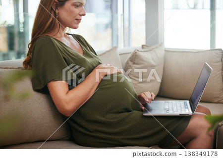 Laptop, freelance and pregnant woman on a sofa typing, search or reading at home. Pregnancy, remote work and female entrepreneur online in living room with social media, web or network communication 138349178