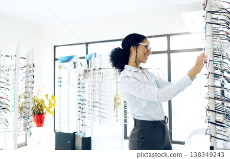Optometry shop, eyeglasses shelf and happy woman for lens frame product, shopping choice or ocular wellness eyewear. Eye care service, visual eyesight support and professional optician check glasses 138349243