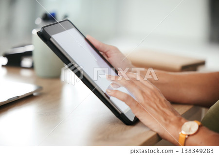 Tablet, hands and closeup of woman in office doing research and reading information on internet. Professional, online and female designer working on project with digital technology in workplace. Tablet, hands and closeup of woman in office doing research and reading information on internet. Professional, online and female designer working on project with digital technology in workplace. 138349283