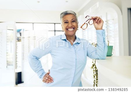 Store portrait, optometrist and happy woman with eyeglasses for optical help, eyesight support and prescription. Happiness, vision glasses and manager smile for lens frame, service or ophthalmology Store portrait, optometrist and happy woman with eyeglasses for optical help, eyesight support and prescription. Happiness, vision glasses and manager smile for lens frame, service or ophthalmology 138349285