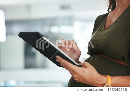 Tablet, hands and pregnant business woman in office doing research and reading information on internet. Maternity, closeup and designer with pregnancy working on digital technology in workplace. 138349316