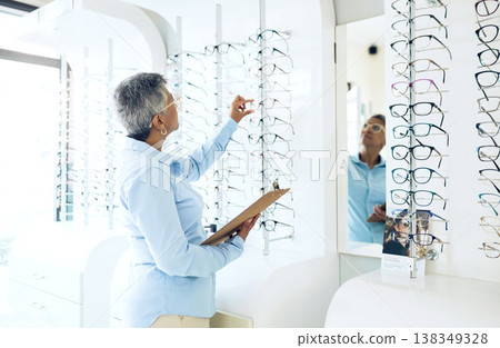 Glasses, eye care or senior woman with retail in store for checklist stock, inventory or eyewear choice. Vision, ophthalmology or optician in frame clinic with clipboard for product in optometry shop Glasses, eye care or senior woman with retail in store for checklist stock, inventory or eyewear choice. Vision, ophthalmology or optician in frame clinic with clipboard for product in optometry shop 138349328