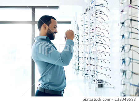 Ophthalmology, glasses and man for eye care decision, choice and options in optician store for vision. Healthcare, optometry and person in clinic to choose prescription lens, spectacles and frames 138349558