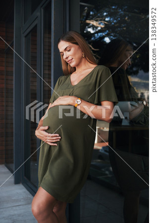 Future, smile and a pregnant woman on an office balcony for business waiting to be a mother. Stomach, pregnancy and happy young employee at the workplace as an employee thinking about maternity leave Future, smile and a pregnant woman on an office balcony for business waiting to be a mother. Stomach, pregnancy and happy young employee at the workplace as an employee thinking about maternity leave 138349572