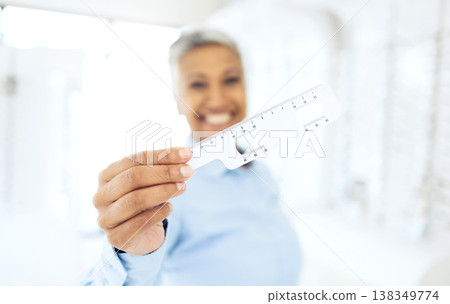 Eye care, woman and ruler or frame for optometry, eyes assessment or eyesight tool with smile for help. Optometrist, person and hand with happiness for vision, healthcare and glasses test or measure Eye care, woman and ruler or frame for optometry, eyes assessment or eyesight tool with smile for help. Optometrist, person and hand with happiness for vision, healthcare and glasses test or measure 138349774