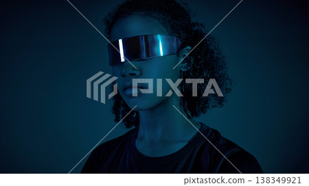 Female teenager athlete portrait wearing reflective visor in minimal dark studio with deep light Female teenager athlete portrait wearing reflective visor in minimal dark studio with deep light 138349921
