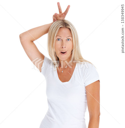 Woman, bunny ears and finger portrait in studio fun surprise, happy or natural face. Female model person, t-shirt and rabbit hand white background for excited, personality emoji or crazy wow comedy Woman, bunny ears and finger portrait in studio fun surprise, happy or natural face. Female model person, t-shirt and rabbit hand white background for excited, personality emoji or crazy wow comedy 138349945