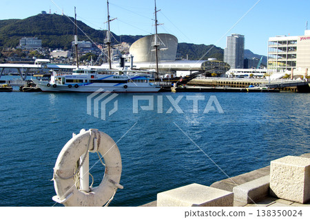 View of the central urban area of Nagasaki City, around Nagasaki Port, towards Mt. Inasa. 138350024