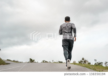 Fitness, back and man on road with running, cardio or stamina exercise in physical activity. Training, space or athlete on path with jog, outdoor workout and sports endurance in New Zealand. 138350194