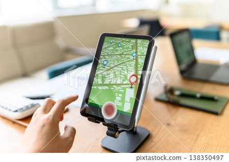 Tablet map operation and finger Tablet map operation and finger 138350497