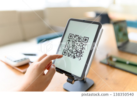 Operate QR codes on a tablet Operate QR codes on a tablet 138350540