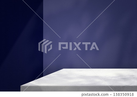 Marble Table Corner with Light Beam, Shadow, and Spotlight on the Blue Concrete Wall Background Marble Table Corner with Light Beam, Shadow, and Spotlight on the Blue Concrete Wall Background 138350918