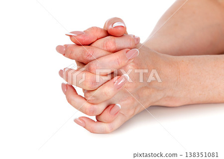 Beautiful female hands with french manicure isolated on a white background 138351081